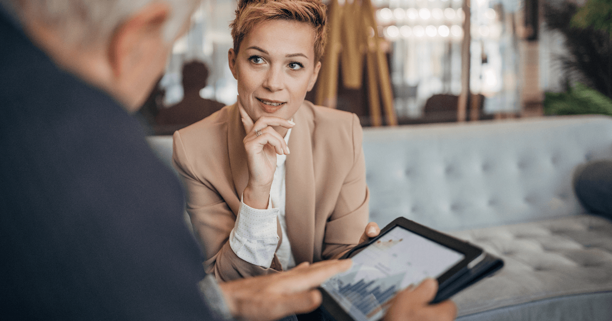 older father discussion business with adult daughter